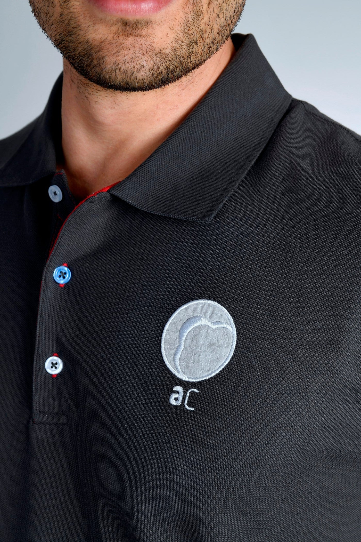 Polo Shirt from our "Artifactcloud" apparel collection. With flown swatch of beta cloth as part of the sticked 'AC' logo.