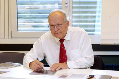 German ESA astronaut Hans Schlegel signs 8x10 litho of his STS-122 EVA