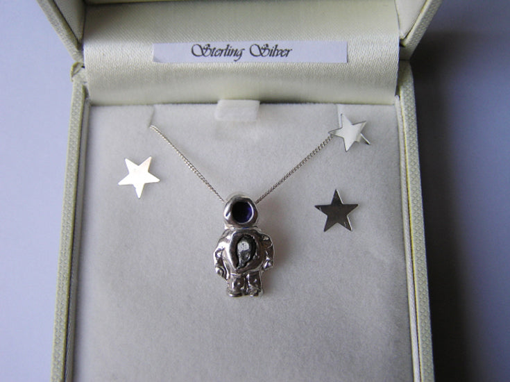 silver spaceman necklace with meteorite iron